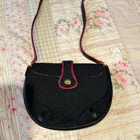 Gucci vintage crossbody bag black with red trim. Beautiful inside has wear shown